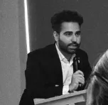 Nikhil Chugh speaking at legal seminar